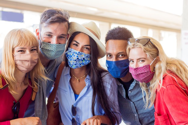 portrait-group-young-happy-friends-wearing-face-mask-during-covid-pandemic_169160-329